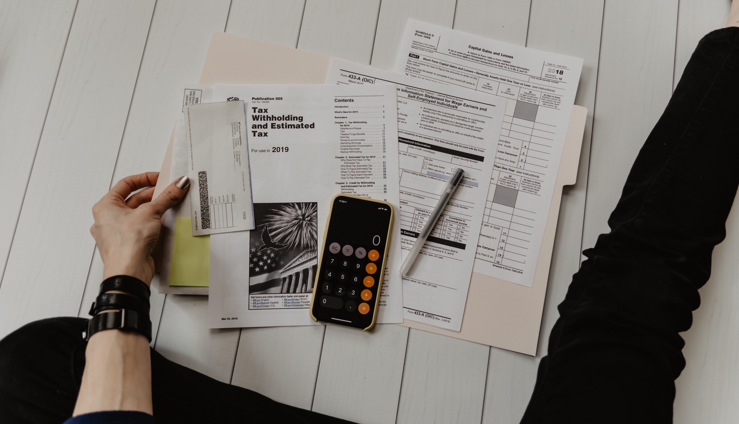 Individual taking their first step in financial empowerment by going through their budgets and filling in their Money Moxie Map